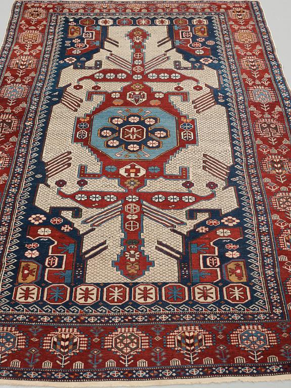 A CARPET, an antique/semi-antique Shirvan, ca 234 x 130 cm (as well as the ends with 1 cm flat weave).