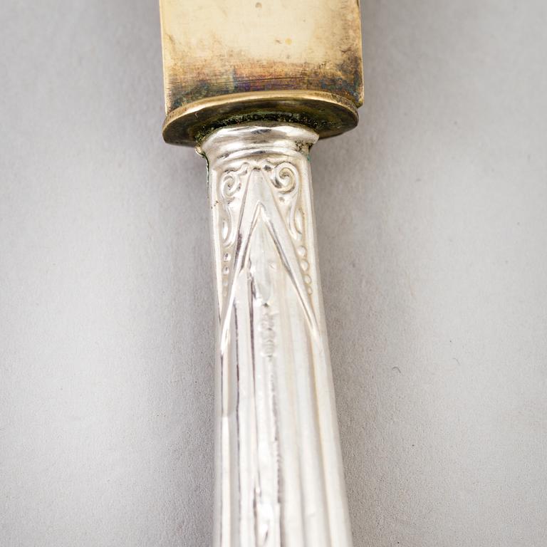 A set of twelve parcel-gilt silver fruite knives from the late 19th century.