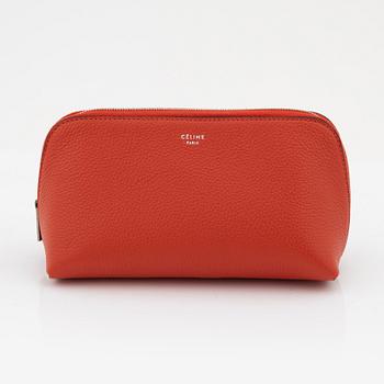 Céline, A cosmetic pouch in bright red leather.