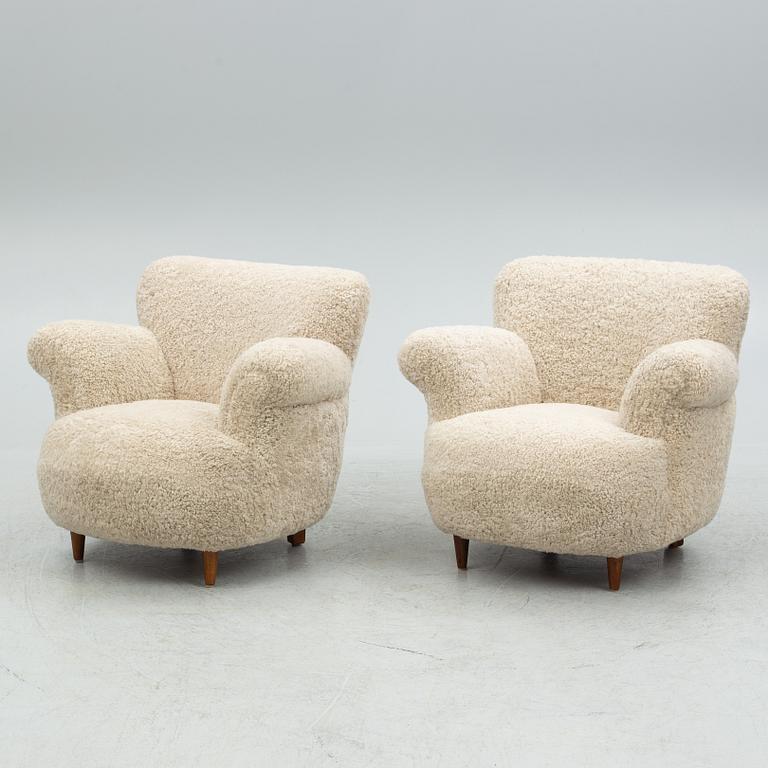 A pair of Swedish Modern easy chairs, mid 20th century.