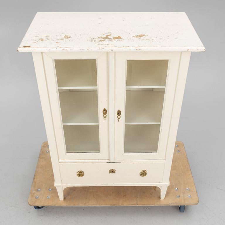 A display cabinet, early 20th century.