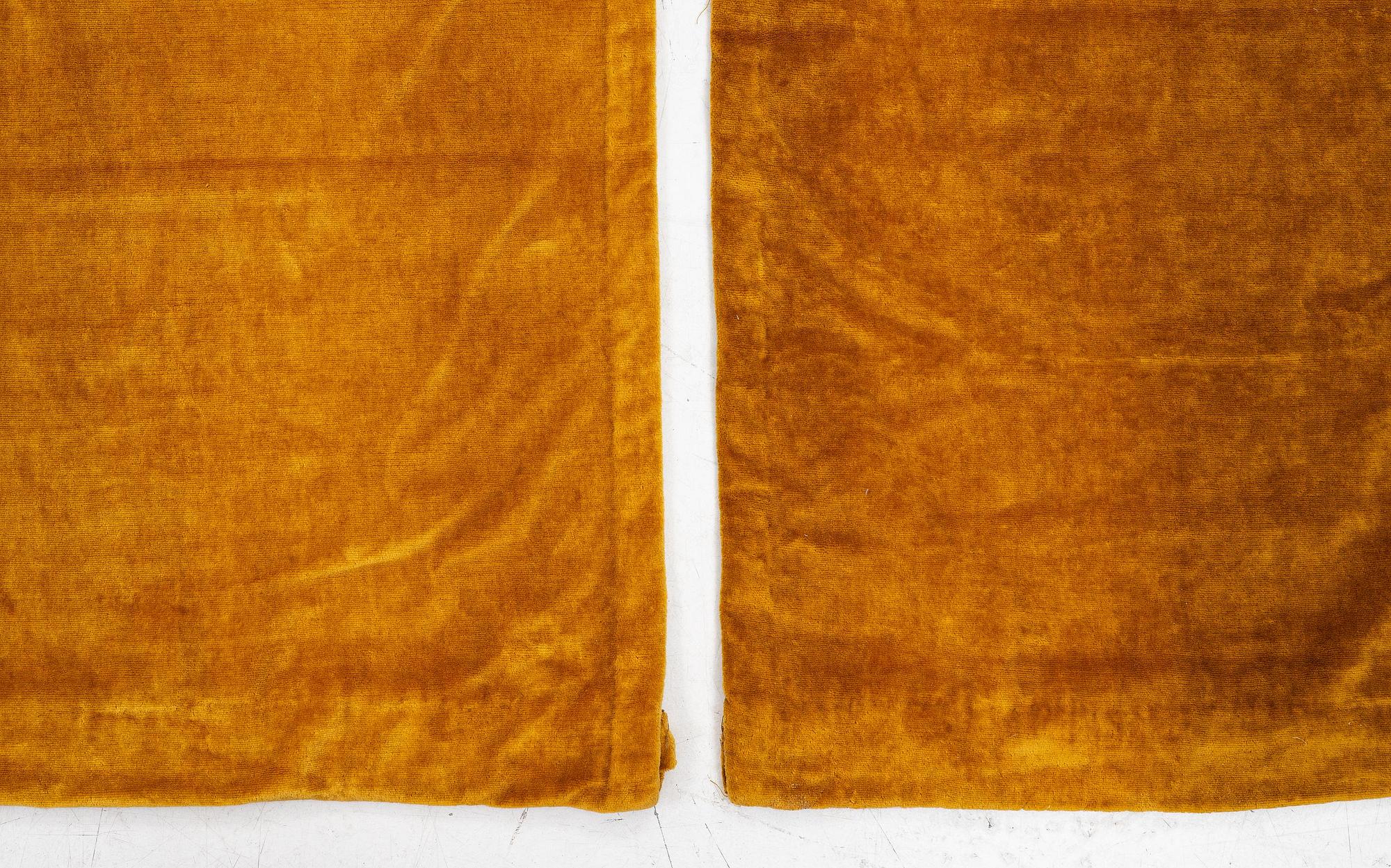 A set of four yellow velvet curtains, 1910's/20's, ca 247 x 120 cm.