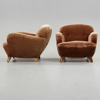 A pair of Mid century Modern easy chairs, probably 1939.