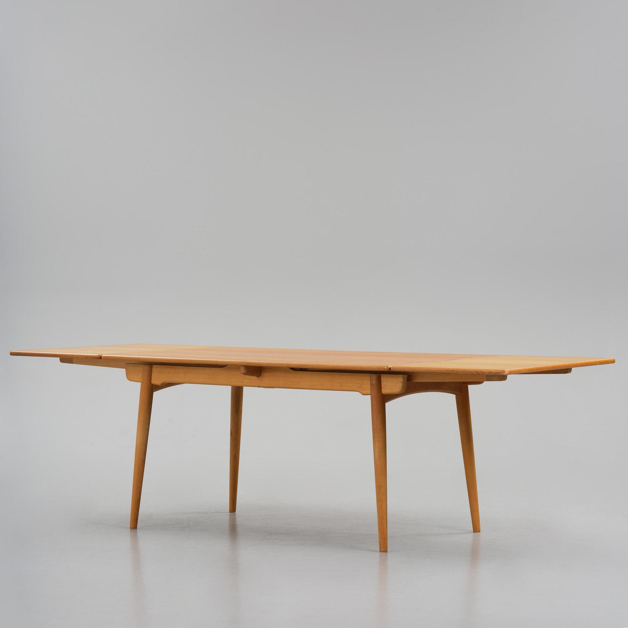 Hans J. Wegner, an "AT-312" dining table, Andreas Tuck, Denmark, 1950s-60s.