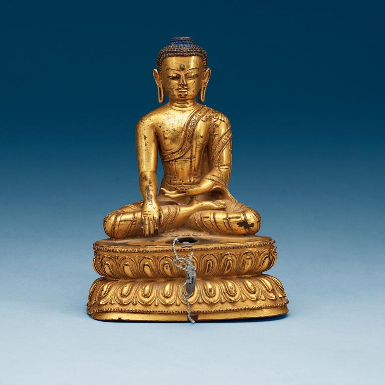 A gilt bronze figure of Buddha, Qing dynasty (1644-1911).