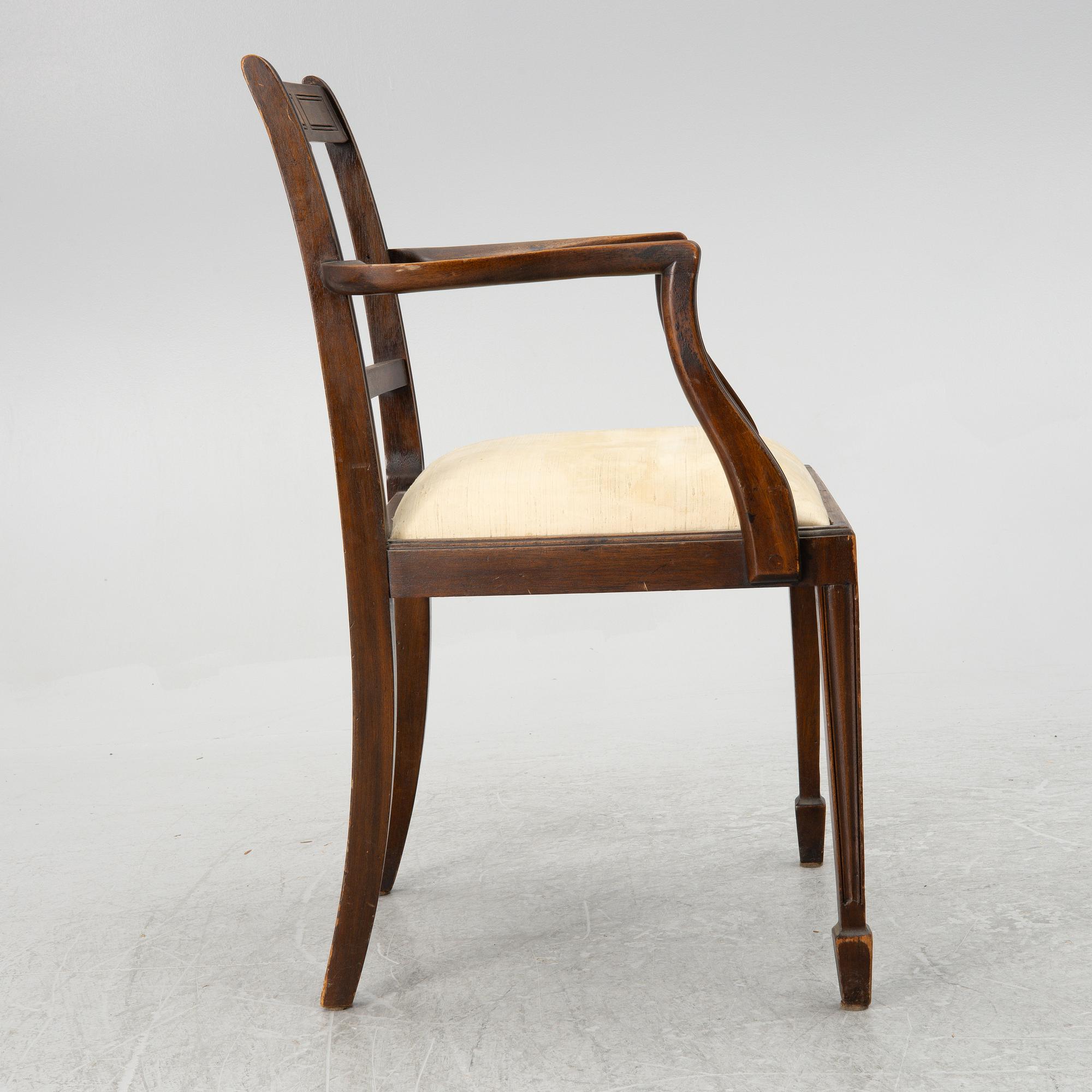 A mahogany and mahogany veneer desk with desk chair, 20th Century.