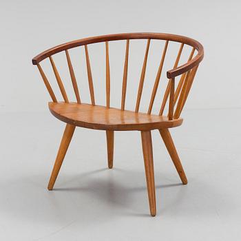 A teak 'Arka' armchair.