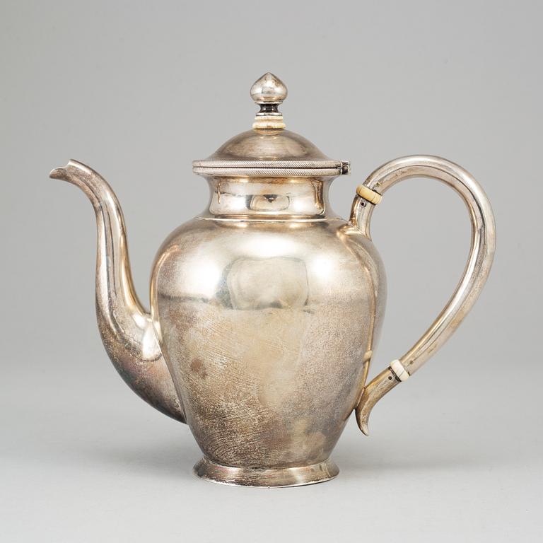 A Russian parcel-gilt silver coffee pot, unidentified makers mark, St. Petersburg 1886.