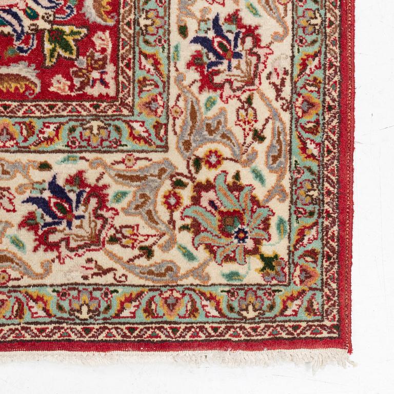 A carpet, Tabriz old, signed, approximately 294 x 208 cm.