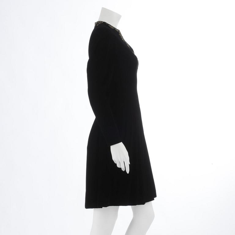 OSCAR DE LA RENTA, a black velvet dress with beading.