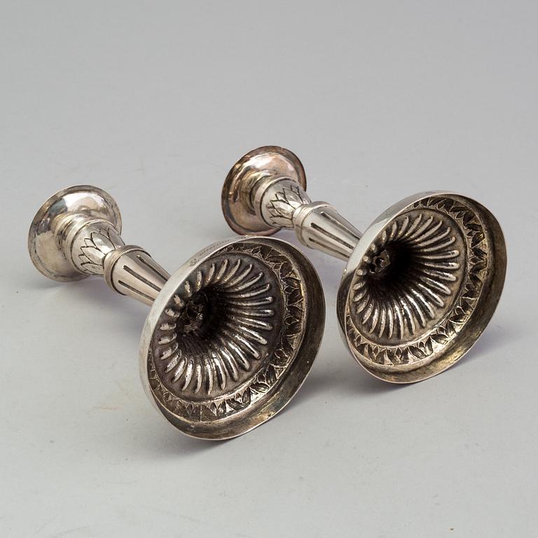 A pair of late 18th century silver candlesticks with unclear hallmarks, possibly from Germany. Weight ca 316 grams.