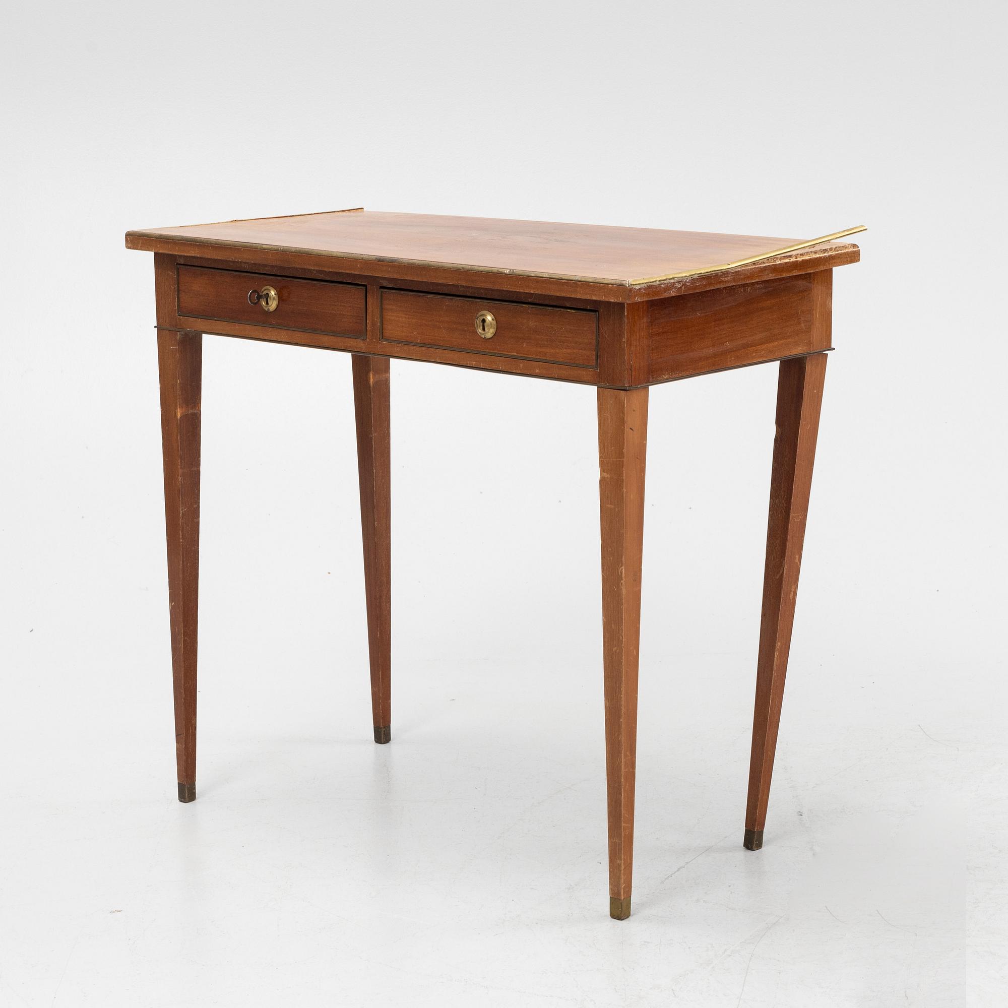 A late Gustavian style mahogany table with drawers.