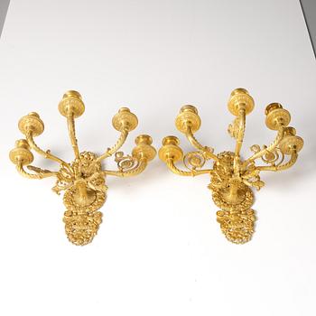 A pair of French Empire ormolu five-branch wall-lights, Paris, early 19th century.