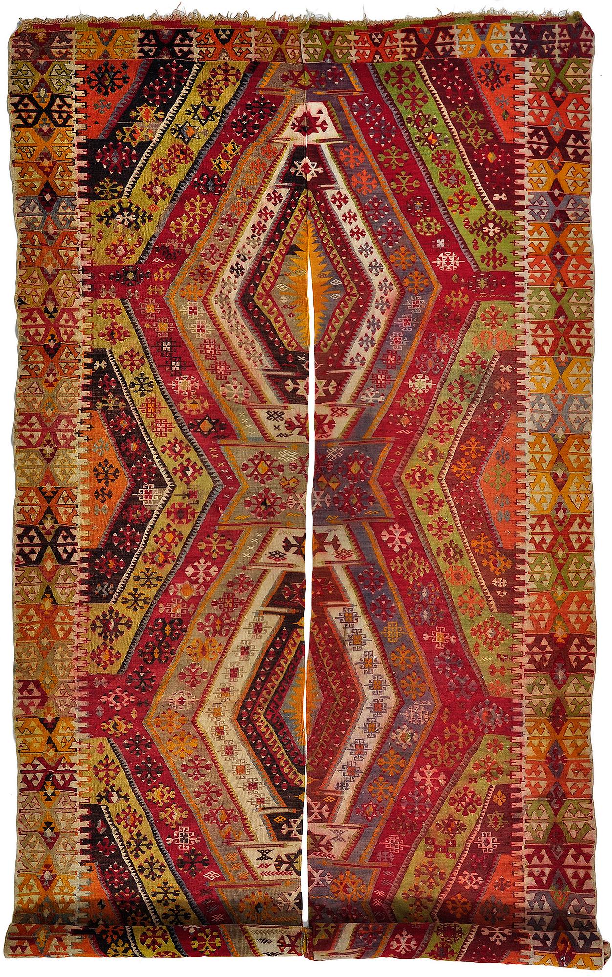 An Antique divided Anatolia kilim with similar patterns ca 433 x 185 cm.
