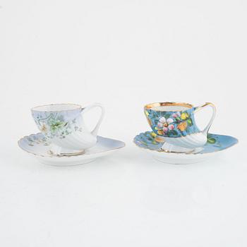 Twelve porcelain coffee cups with saucers, Kuznetsov, Russia, early 20th Century.