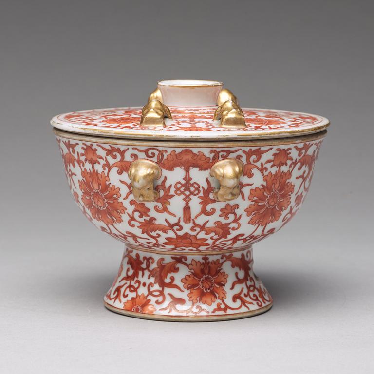 A iron red decorated bowl with cover, Qing dynasty with Daoguang mark in red.