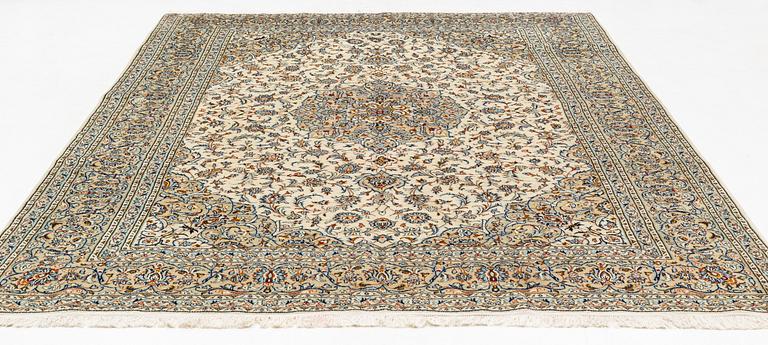 A Keschan carpet, signed, c. 350 x 245 cm.