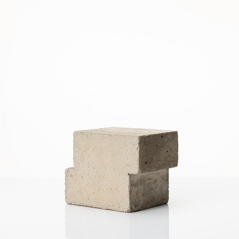 Stina Lindholm, a contemporary concrete planter 'Spira', a concrete flower pot and a wall clock.