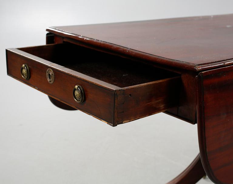A drop-leaf table, English style, late 19th century.