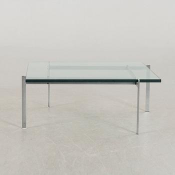 A Poul Kjaerholm PK61 glass table by Fritz Hansen.