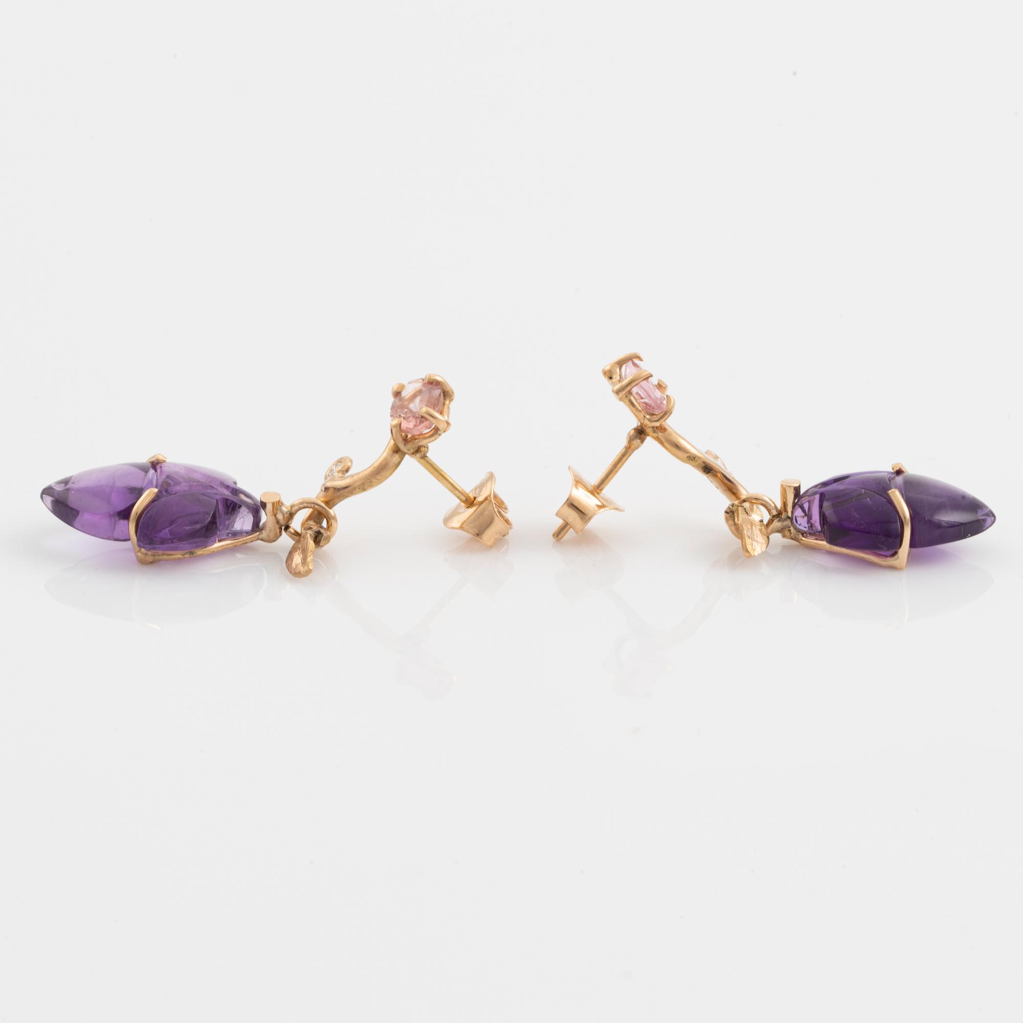 Earrings with cut amethysts, tourmaline, and small diamonds.