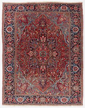 An Antique Heriz carpet, North west persia, c. 380 x 310 cm.