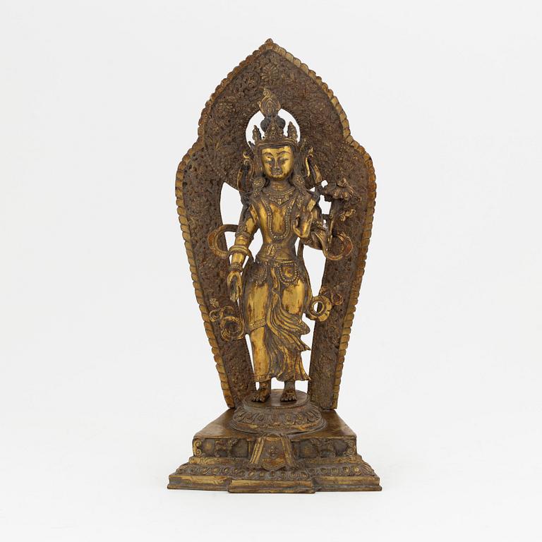 A gilt copper-alloy figure of Boddhisatva Avalokiteshvara, Nepal, 20th century.