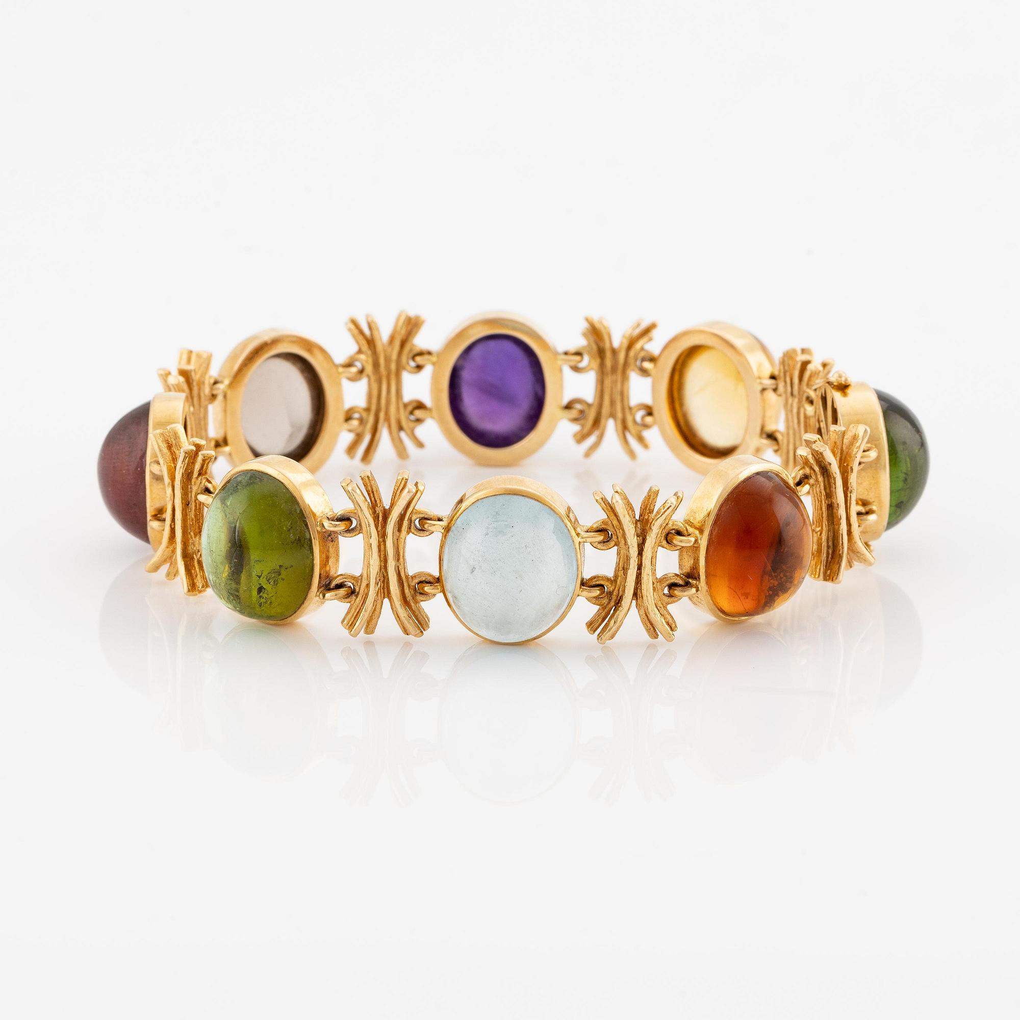 W.A. Bolin, design Barbro Littmarck, armband, 18K guld med cabochonslipade färgstenar, Stockholm 1970.