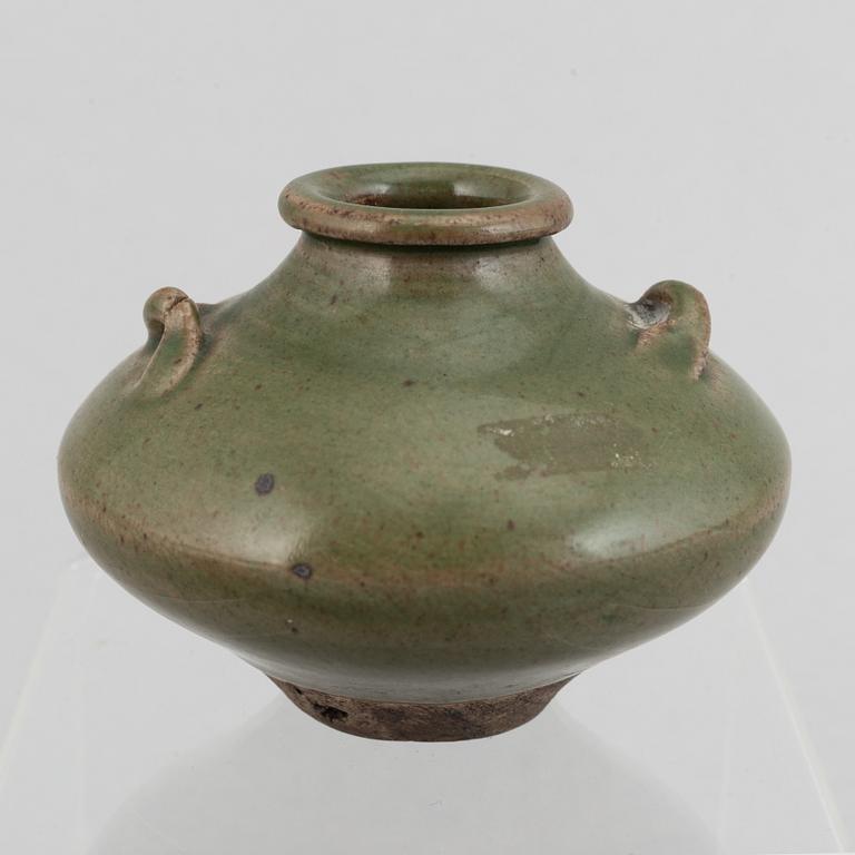 A group of four blue and white porcelain objects and a celadon green glazed jar, Qing dynasty, 18th century.