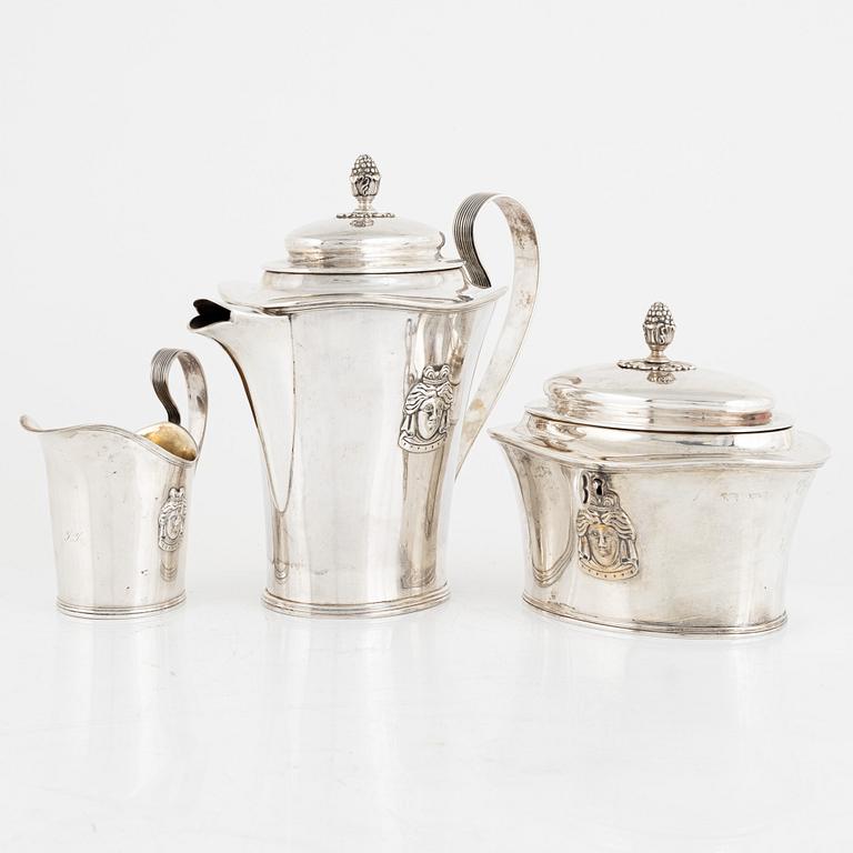 A Swedish silver coffee pot, a sugarbox and a creamer, including Gustaf Hamnqvist, Åmål 1809.