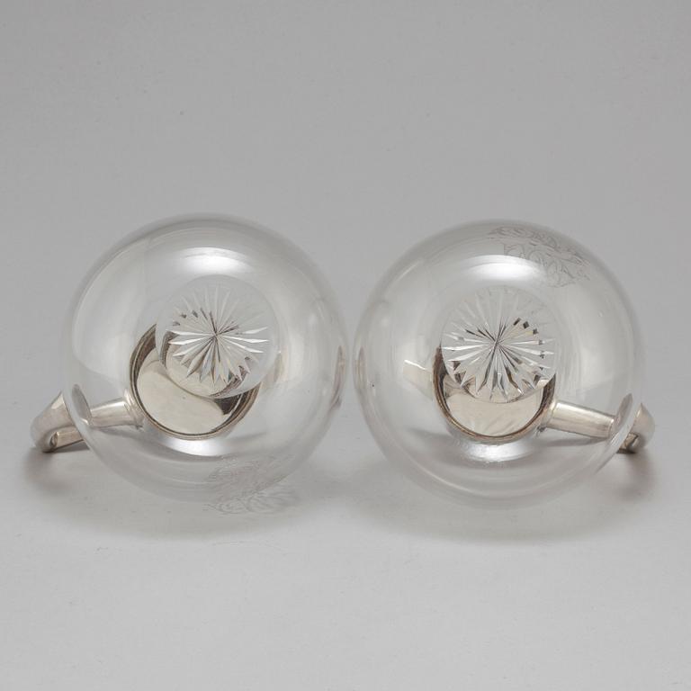 A pair of caraffes with silver mountings by CG Hallberg, Stockholm 1890.