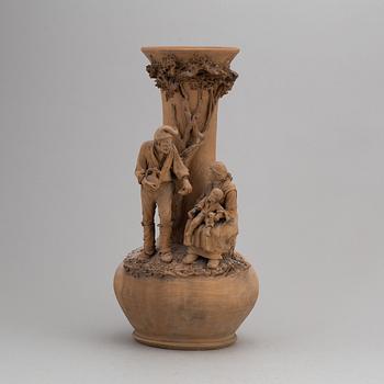 GIUSEPPE VACCARO CALTAGIRONE, a signed terracotta sculpture with vase.