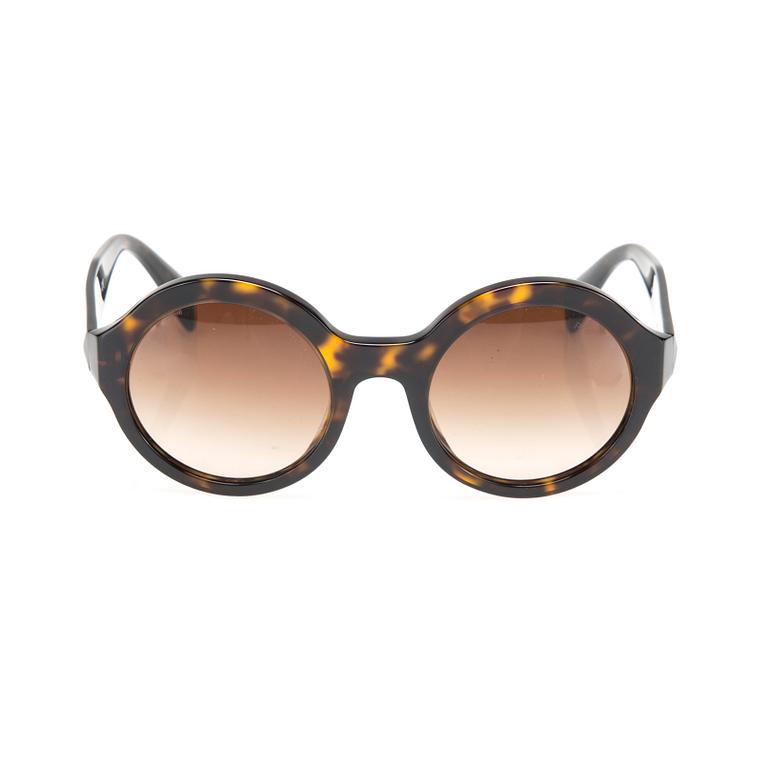 SOLGLASÖGON, Prada.