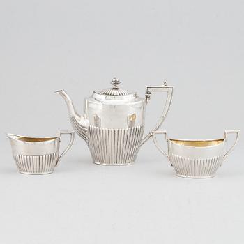 A silver mocha pot, creamer and sugar bowl, swedish import mark of NL Dahlström & Co, Örebro 1930.
