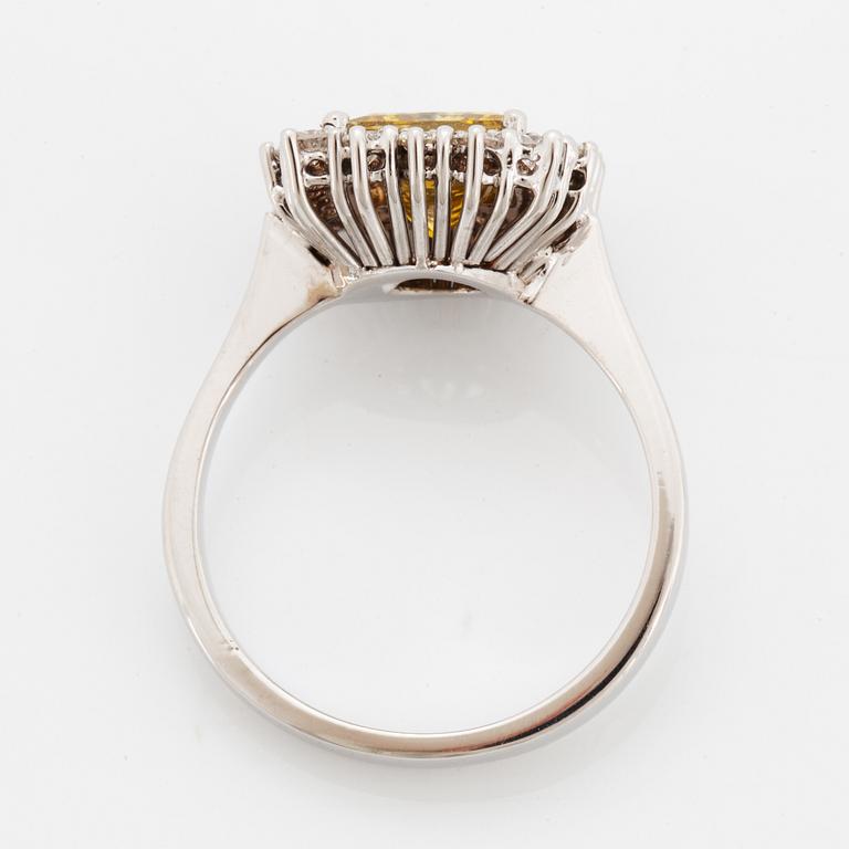 Princess-cut colour treated fancy deep brown-yellow diamond ring.