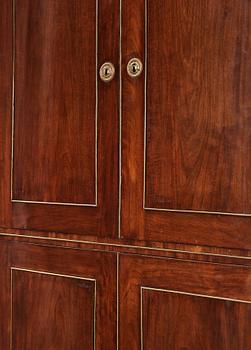 A late Gustavian mahogny cupboard.