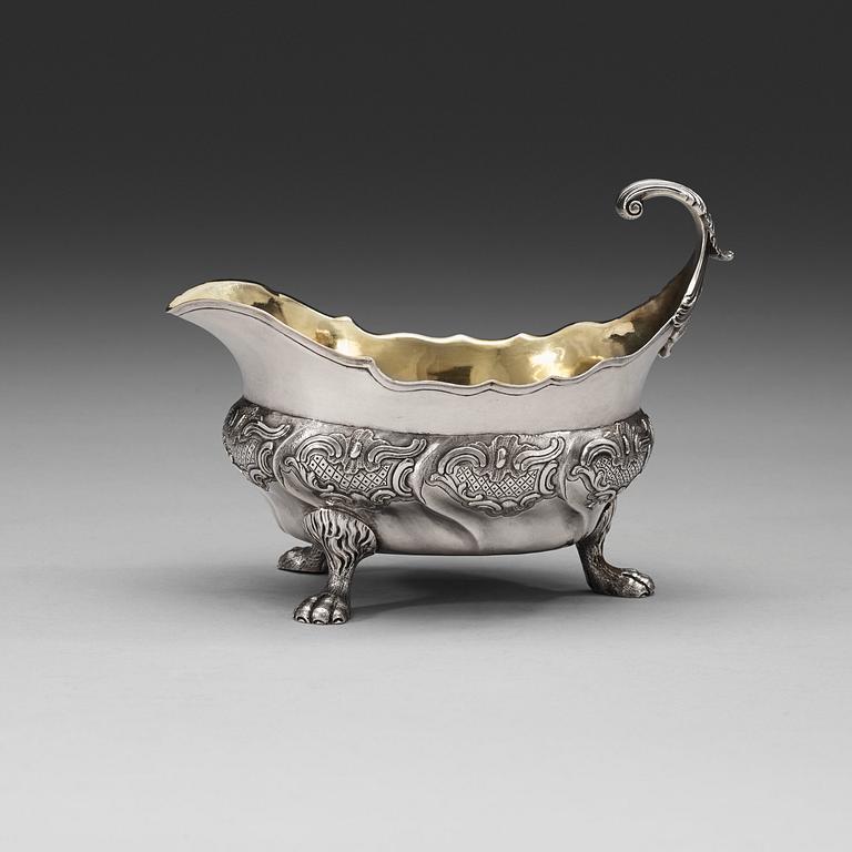 A Swedish mid 18th century parcel-gilt sauce-boat, marks of Kilian Kelson, Stockholm 1755.