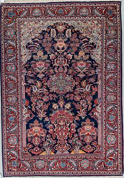 A semi-antique Kashan rug, 208 x 144 cm.