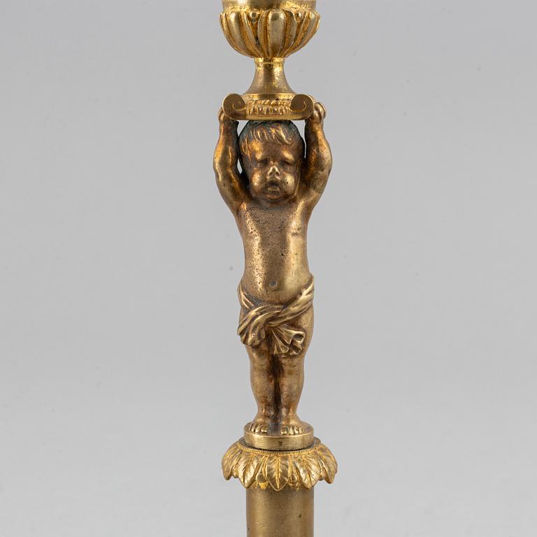 A pair of 19th Century bronze empire style candlesticks.