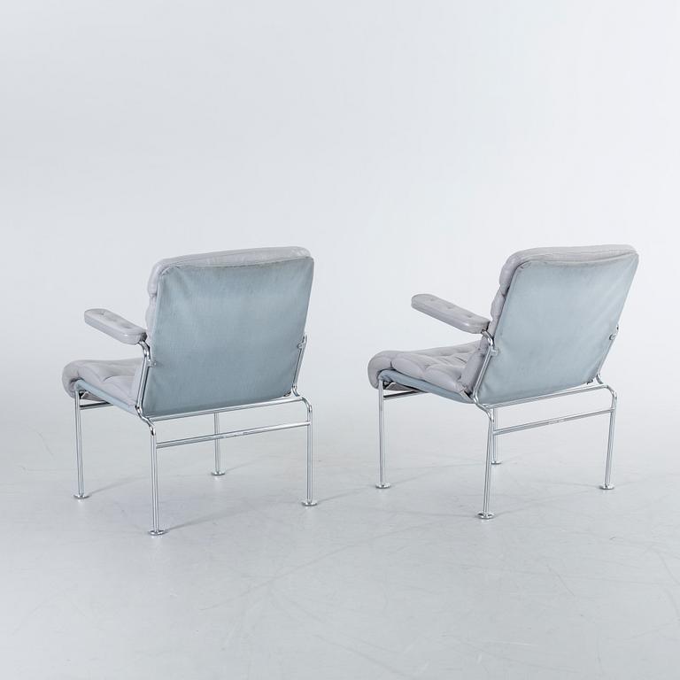 A COUPLE OF BRUNO MATHSSON ARMCHAIRS.