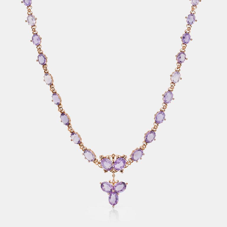 An amethyst and seed pearl necklace. French hallmarks.