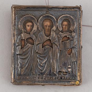Two Russian 19th century travle icon, oklad in silver and parce-gilt, one with assayer mark AA 1890.