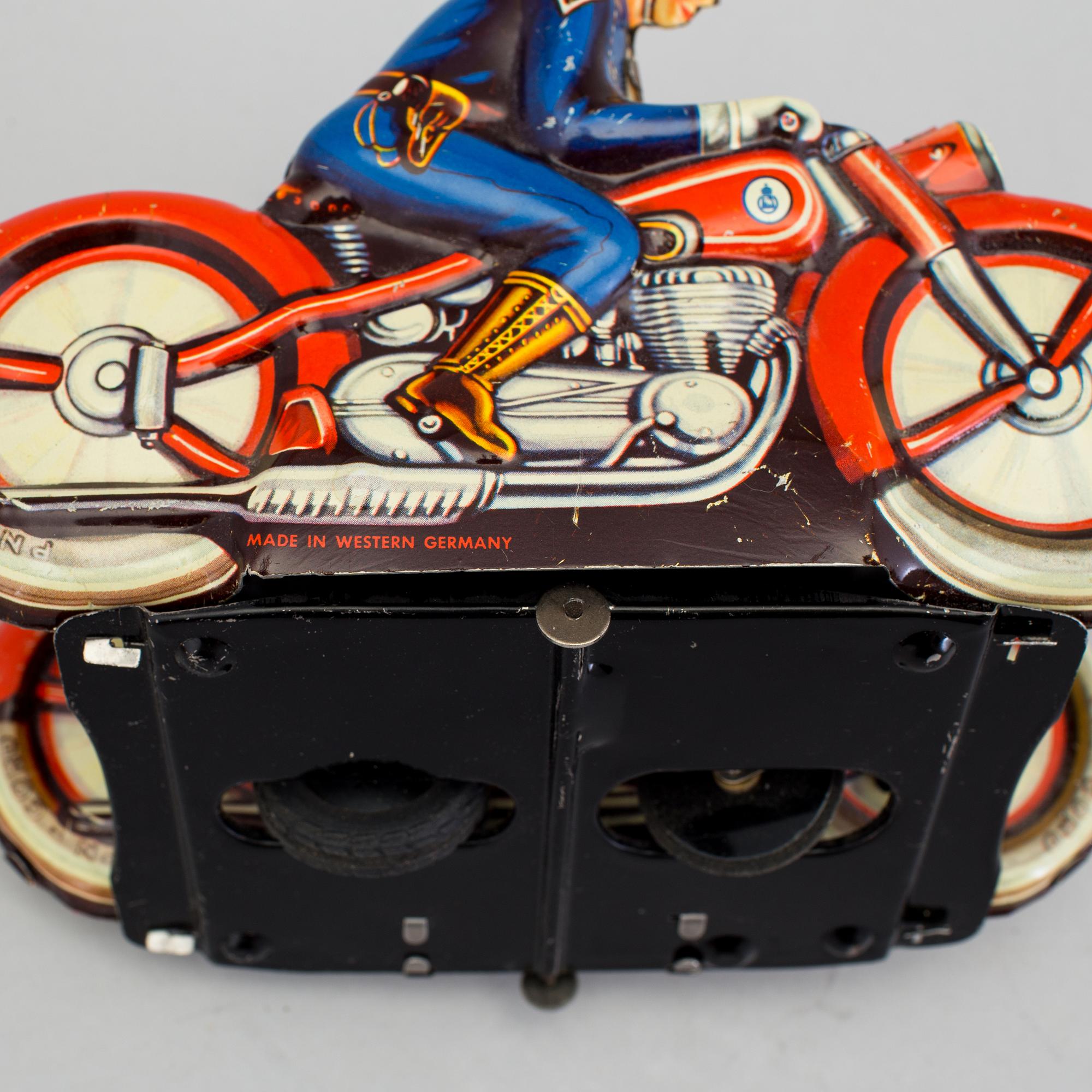 A tinplate synchronous motorcycle by Philipp Niedermeier, Germany, 1950s.