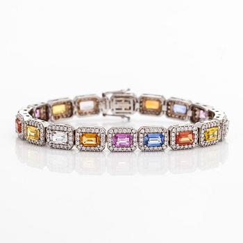 An 18K white gold bracelet with multi-colour sapphires and diamonds.
