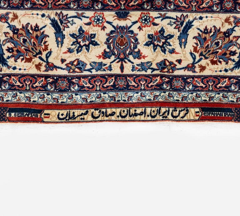 A semi-antique Isfahan rug, Central Persia, signed (Sadegh) Seirafian, c. 237 x 146 cm.