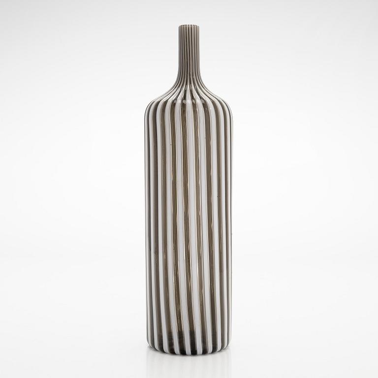 Gio Ponti, a glass bottle '4500' signed Venini, Murano and three drinking glasses, Italy.