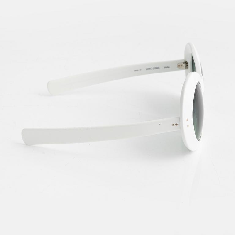 Oliver Goldsmith, a pair of white "Koko" sunglasses.