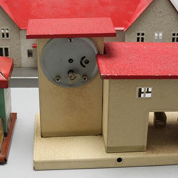 Eight 20th century train model accessories, Germany and England.