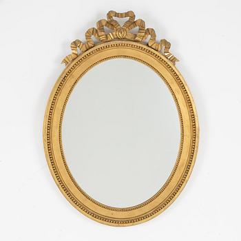 A gustavian style mirror, beginning of the 20th century.