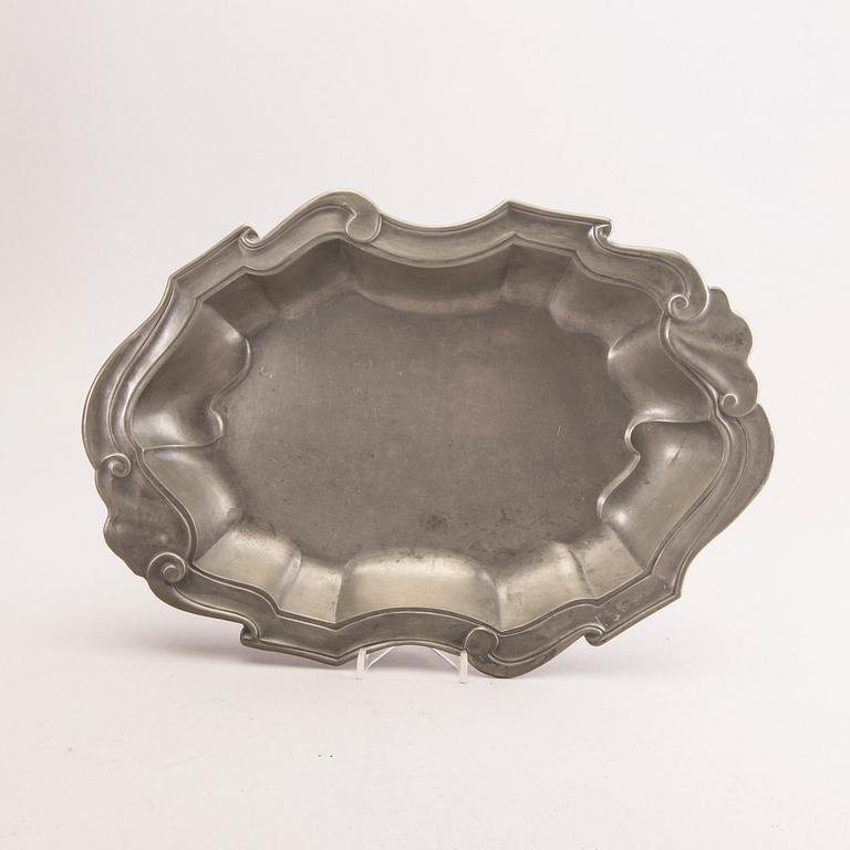 A pewter bowl with lid, a candelabra and a tray from Firma Svenskt Tenn 1927, 1930 and 1960.